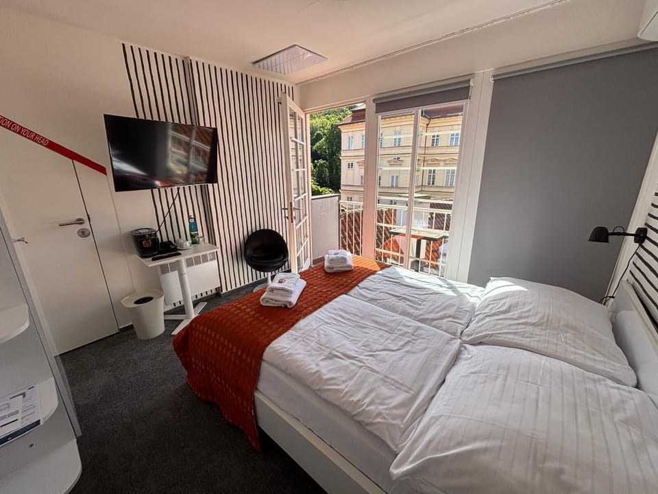 Small Double Room with Balcony | 1 bedroom, in-room safe, laptop workspace, blackout drapes