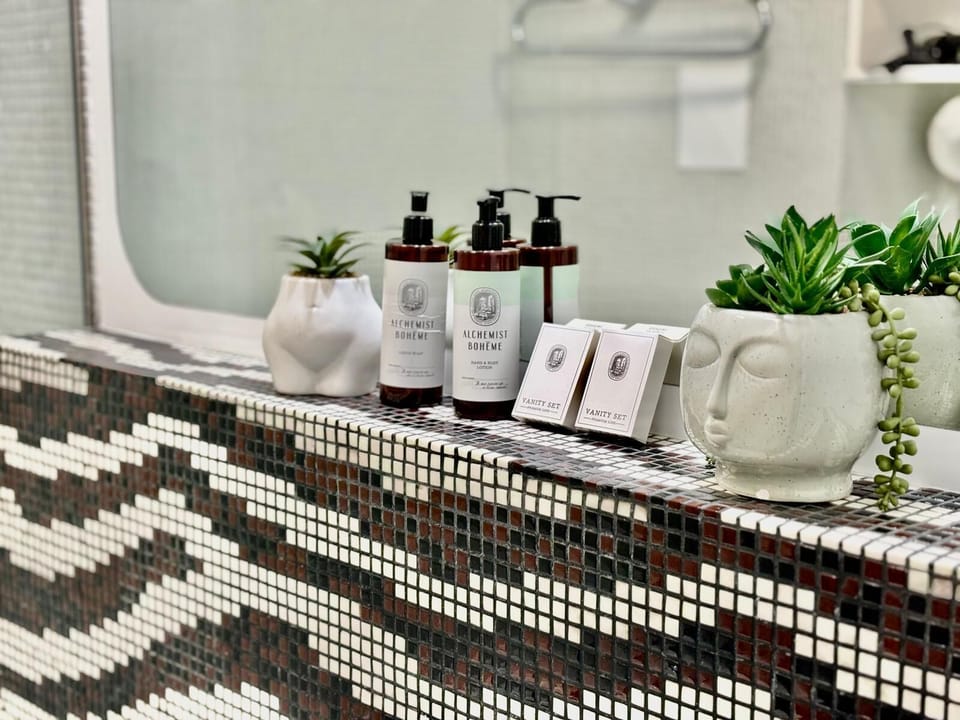 Family Suite | Bathroom | Designer toiletries, hair dryer, towels, soap