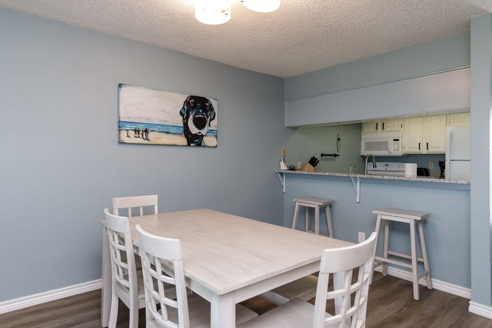 Your bright dining space flows seamlessly into the fully equipped kitchen, perfect for family meals and morning coffee.