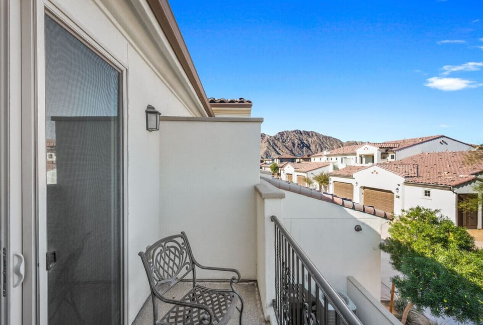 Private balcony w/ seating & scenic neighborhood views, perfect for fresh air moments