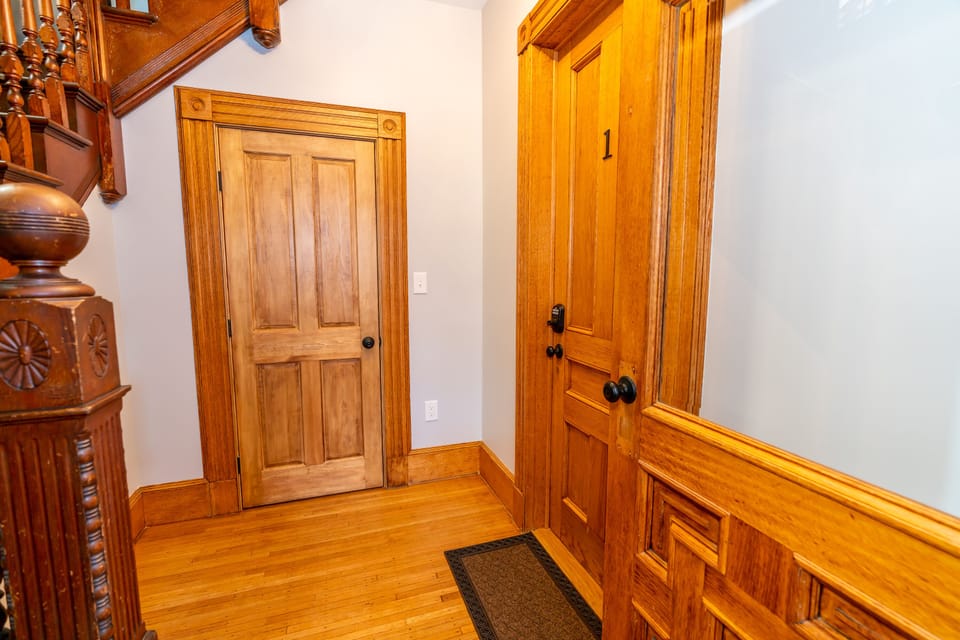Foyer with incredibly restored woodwork.