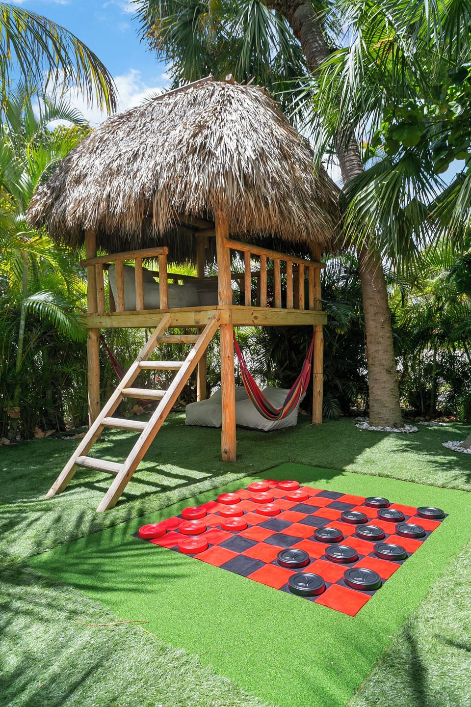 2 story Tiki hutt with Lights at night!  Large Yard games as well!