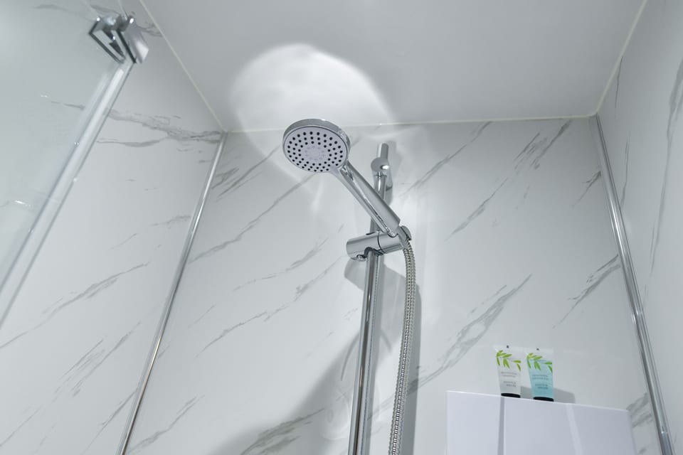 Comfort Single Room | Bathroom | Shower, hair dryer, towels, soap