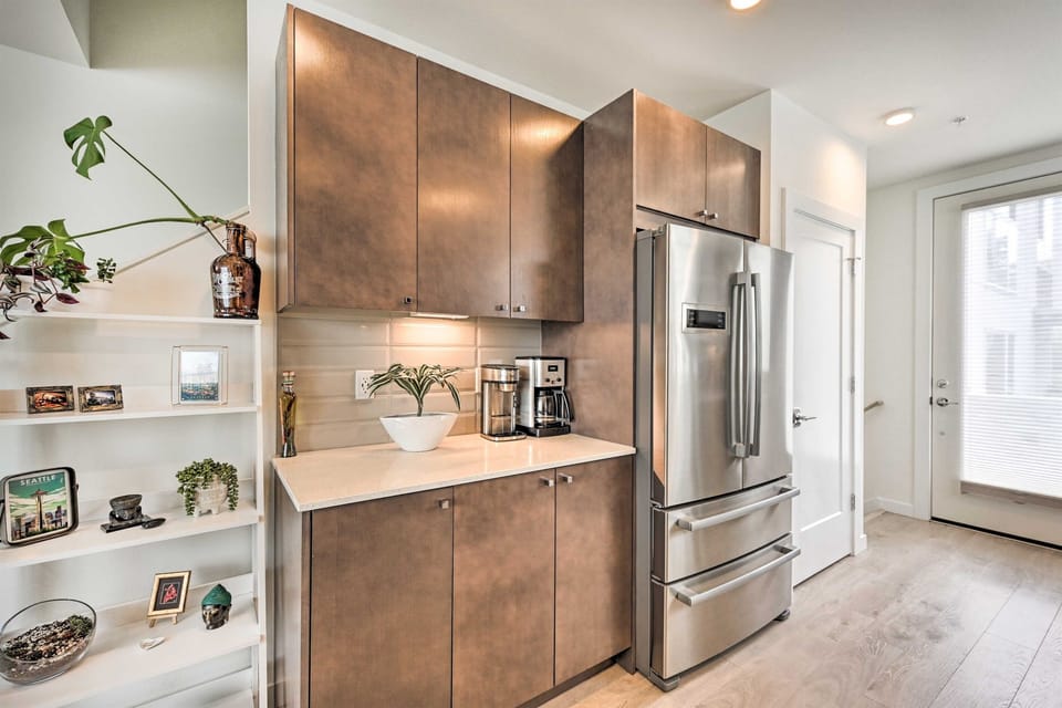 kitchen with coffee maker. Coffee included