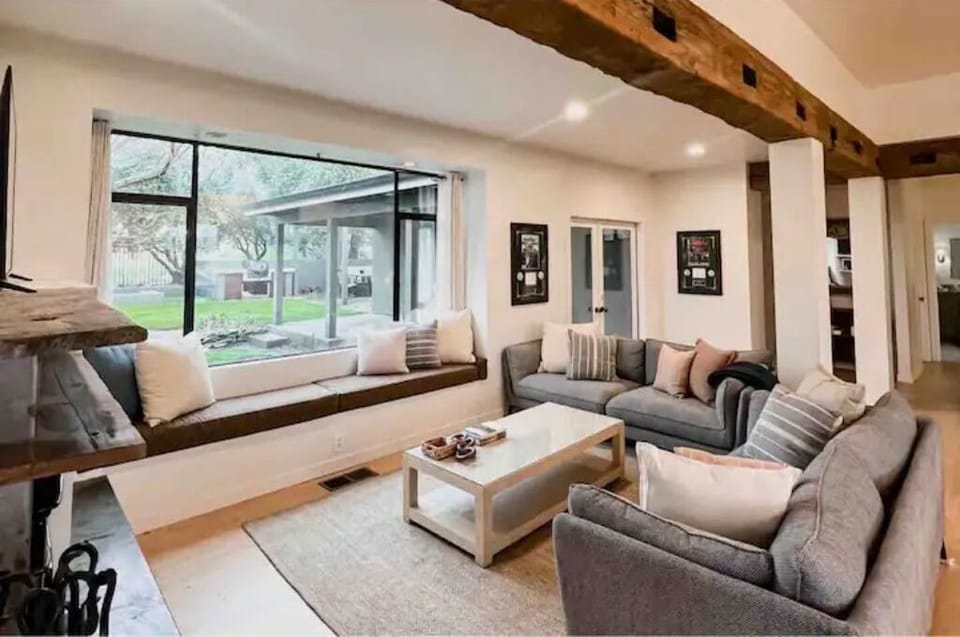 The living room is a warm & inviting area featuring a flat screen TV & Fireplace