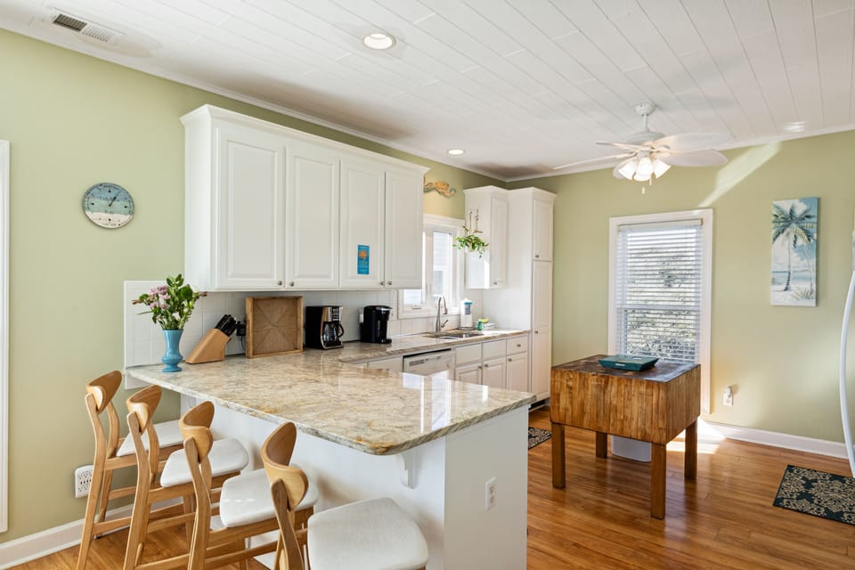 Kitchen with breakfast bar with seating for four.