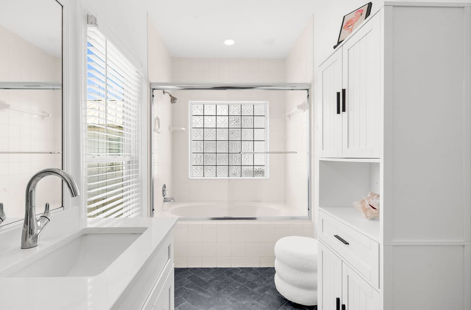 The primary bathroom featuring a soaking tub, offering a relaxing space to unwind.