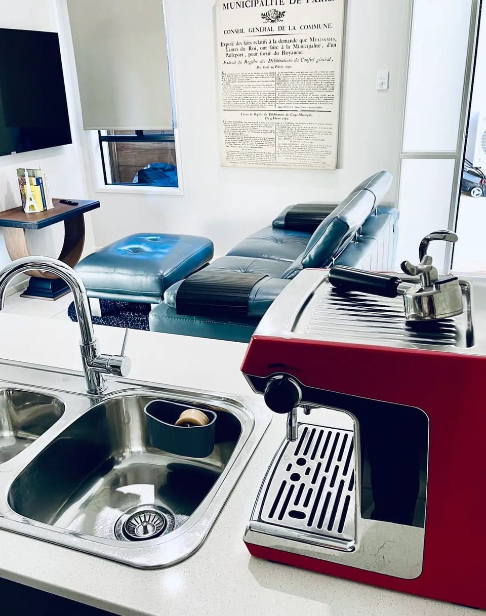 Fully-equipped kitchen: large fridge, stove, oven, microwave and coffee machine
