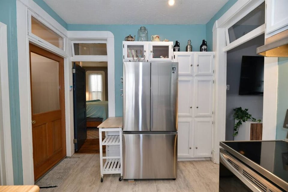 Full sized refrigerator with freezer and ice maker.