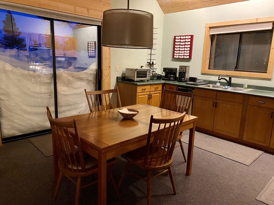 Kitchen table nicely seats 4, or expands to accommodate 8