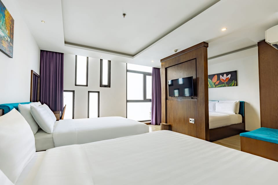 Deluxe Family 3 Double Beds | Minibar, in-room safe, desk, laptop workspace