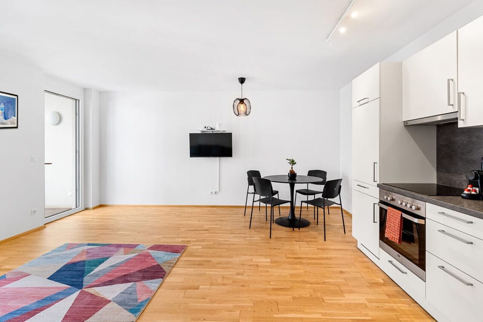 Living room with the smart TV that you can also enjoy while having a meal with your friends