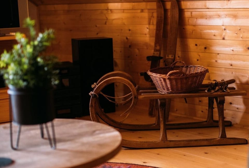 Unique vintage decor with rustic sled and skis adds mountain charm