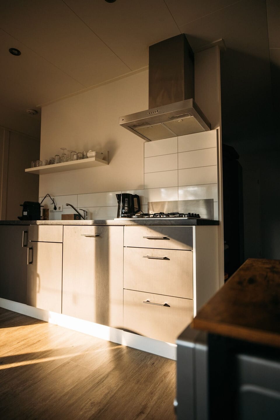 Modern kitchen featuring dishwasher gas cooking and Nespresso coffee machine