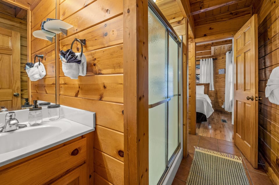 Bathroom on the main level, connected to the bedroom and living room