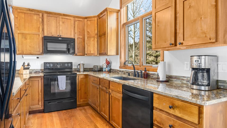 Bright, spacious kitchen with modern appliances and natural light