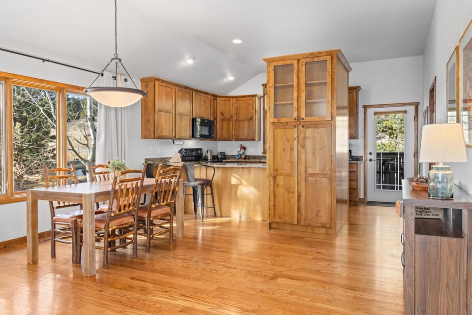 Kitchen and dining area with warm wood accents