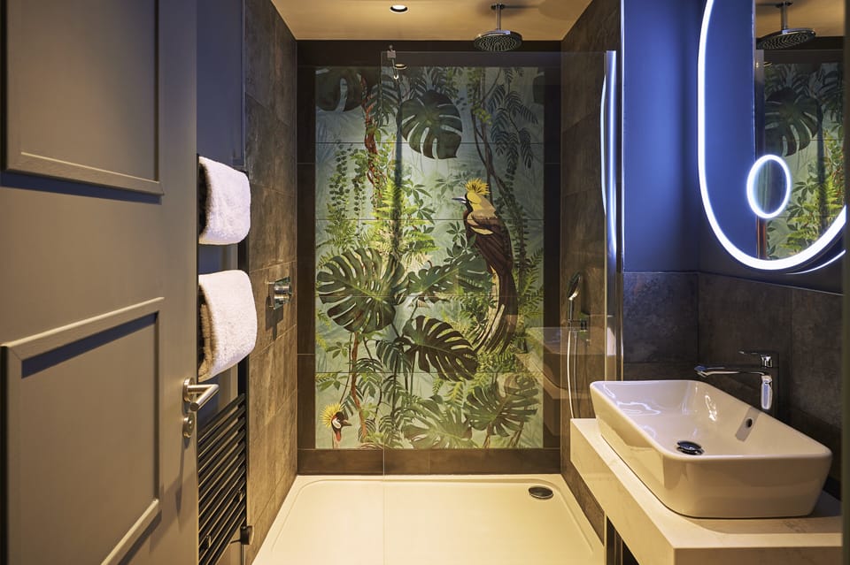 Shower, rainfall showerhead, hair dryer, towels