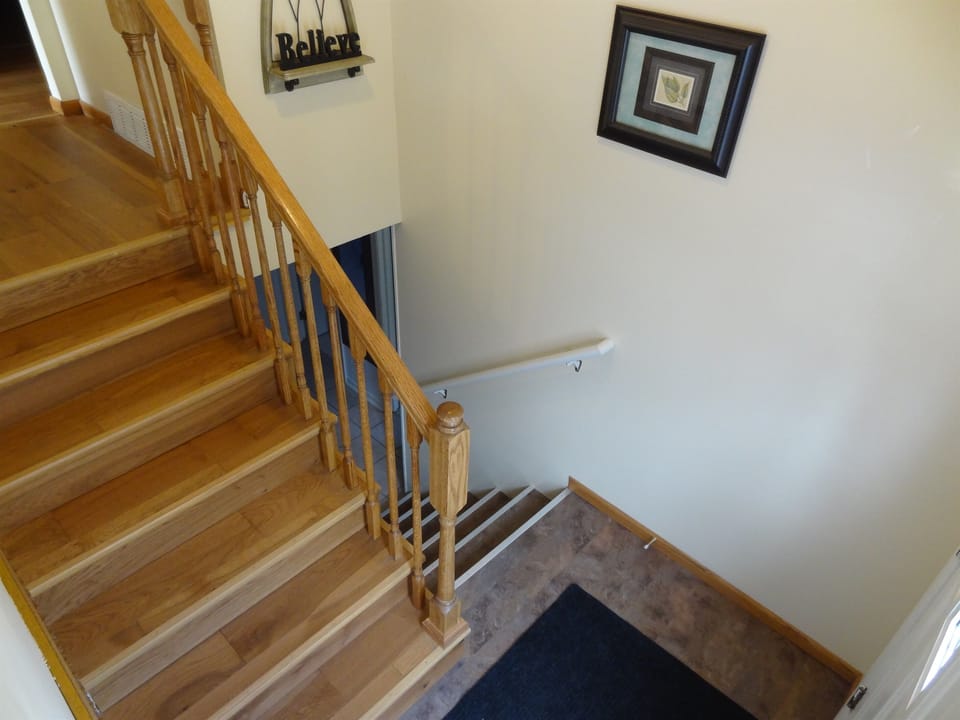 Steps needed to go to the 3 bedrooms and Kitchen. Full sized couch downstairs