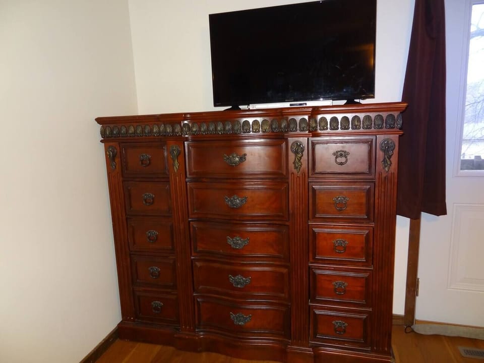 Master bedroom dresser and tv.