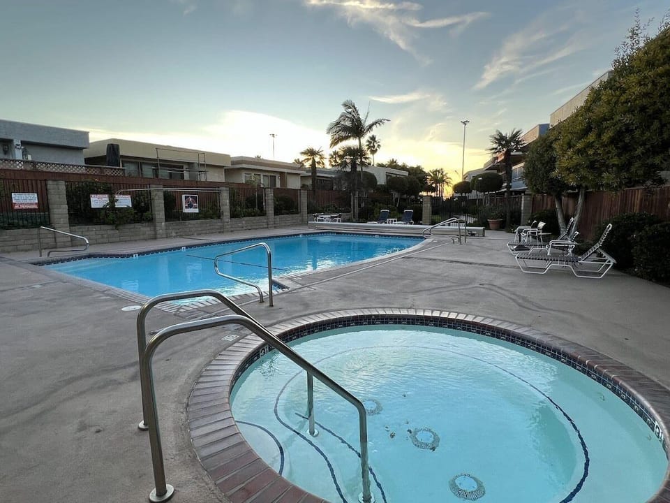 Relax in the shared hot tub after a beach day