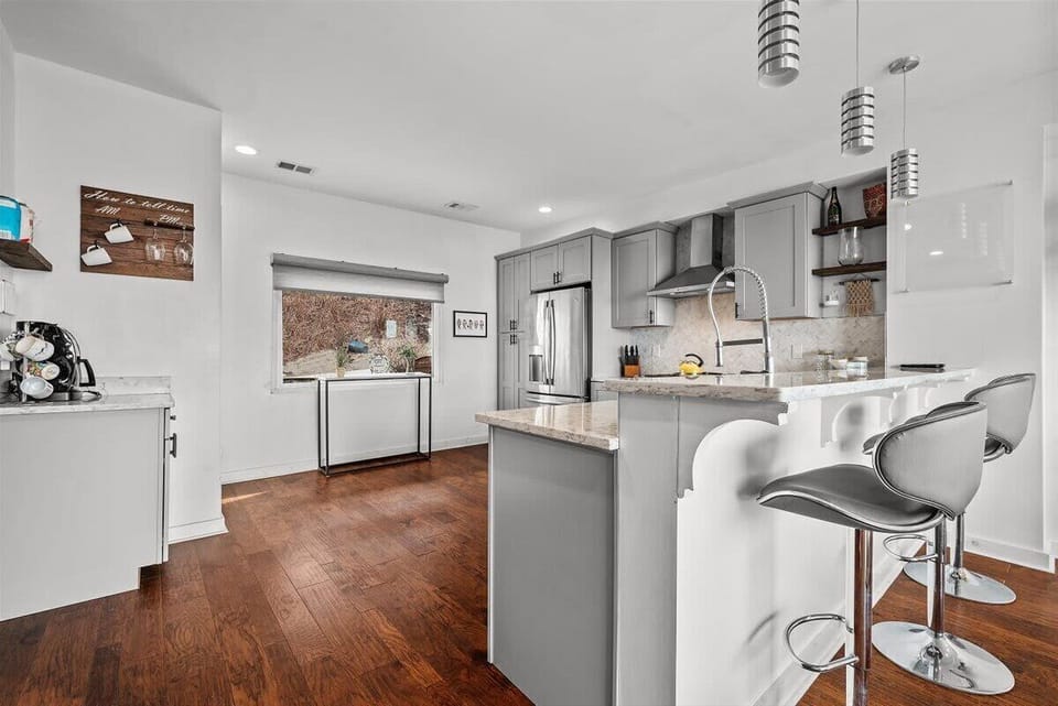 Another view of the kitchen with bar seating