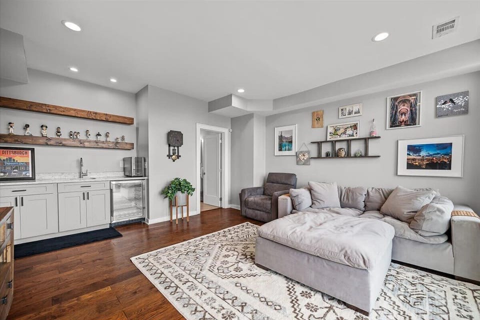 Downstairs from the main level is the living room/deck access/full bathroom
