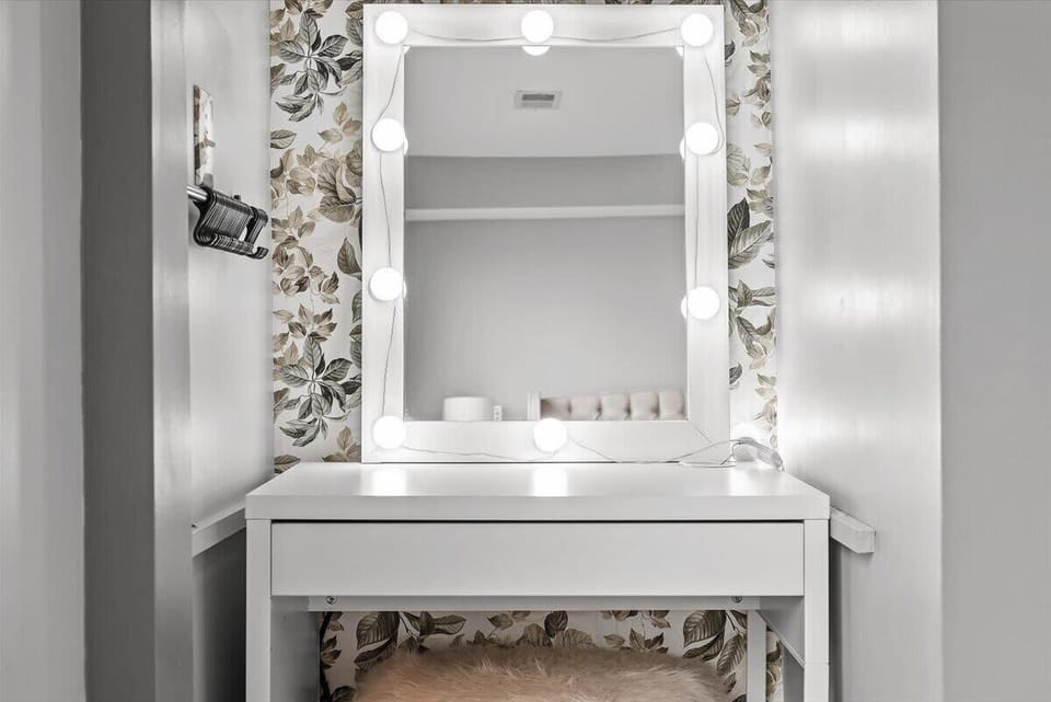 A small desk/make up counter in the main bedroom