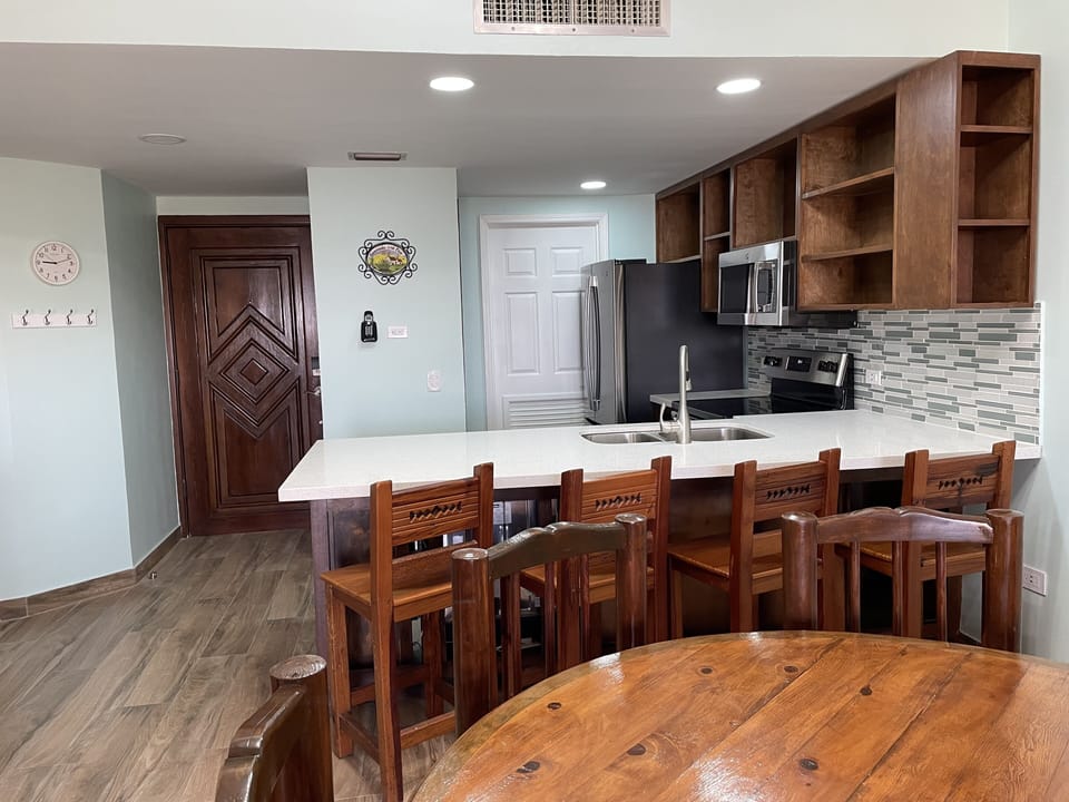 Kitchen area before cabinet doors installed. Door installed.  Just need new pics
