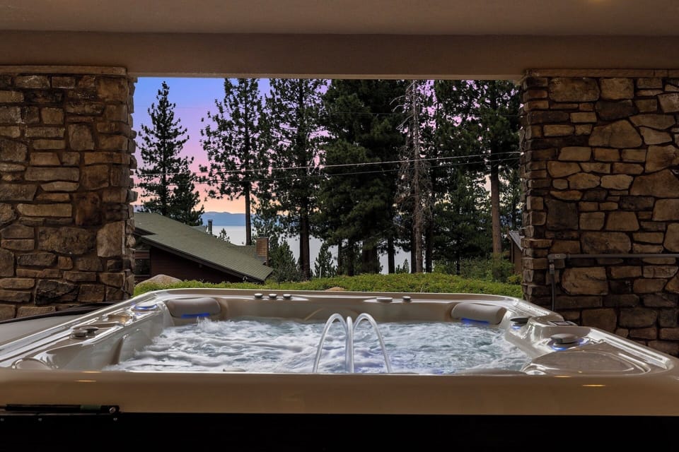 Private lakeview hot tub tucked under the deck.