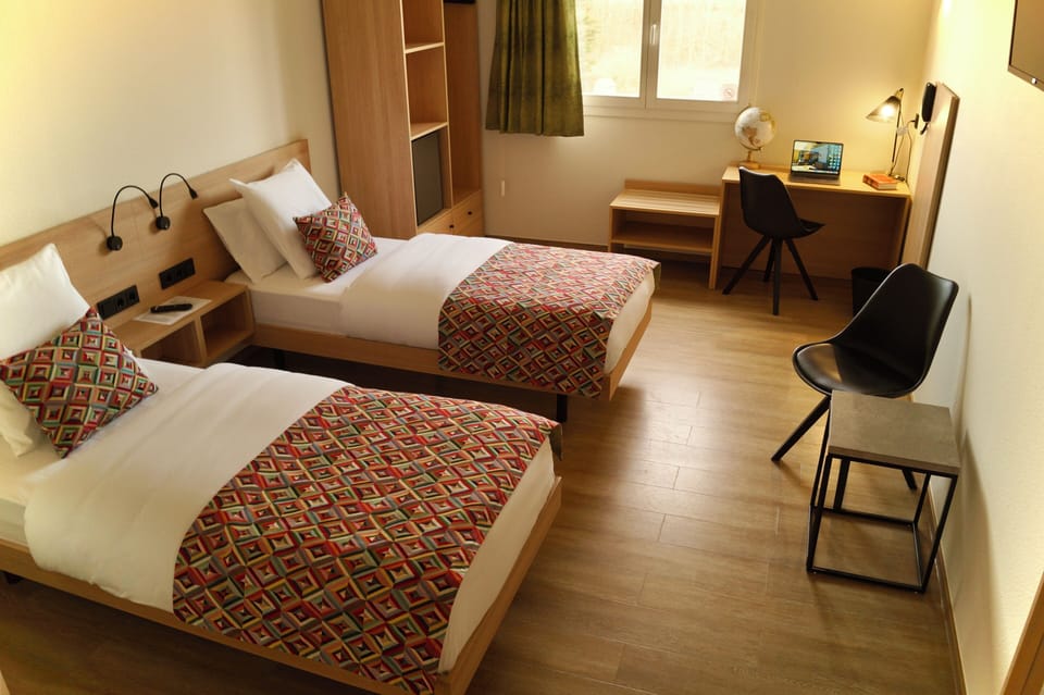 Twin Room | Desk, blackout drapes, soundproofing, iron/ironing board (on request)