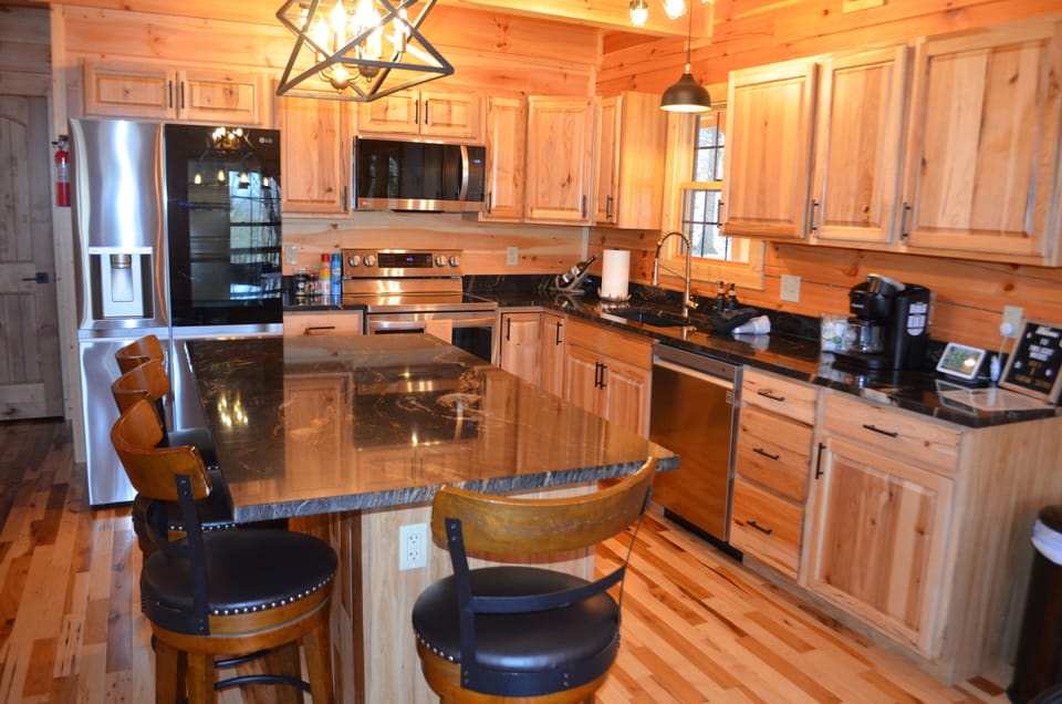 kitchen with fridge that makes ice balls perfect for drinks