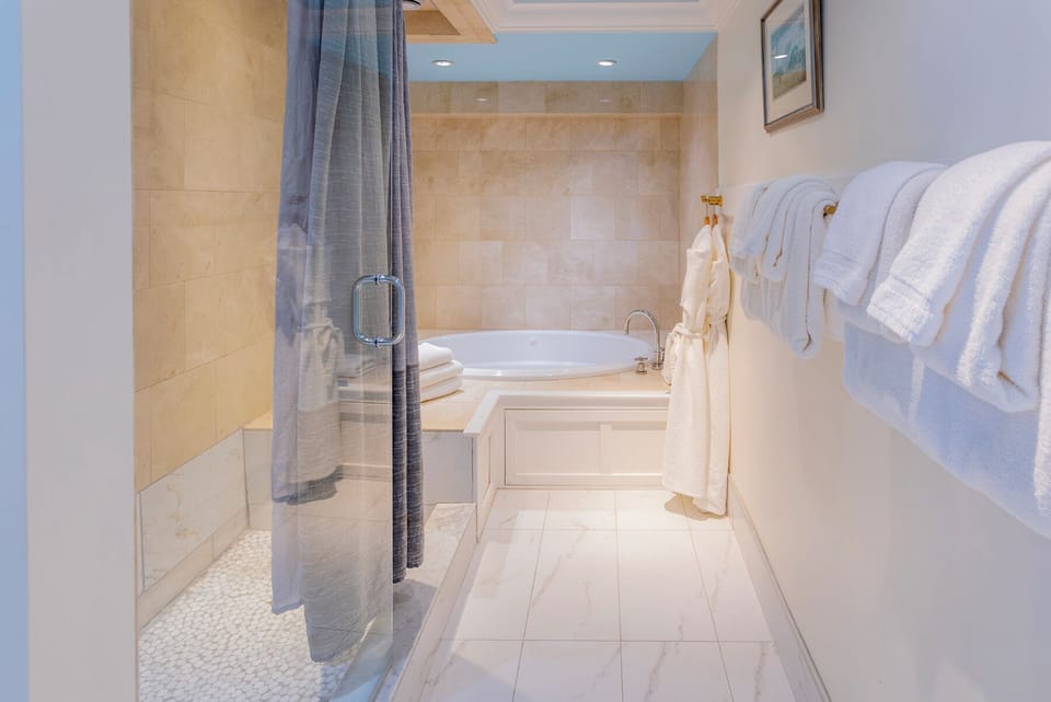 Waterside Cottage | Bathroom | Shower, free toiletries, hair dryer, bathrobes