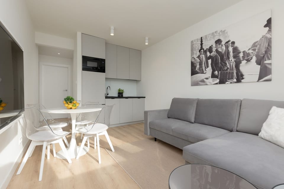 A kitchen and dining area blending modern aesthetics with functionality.
