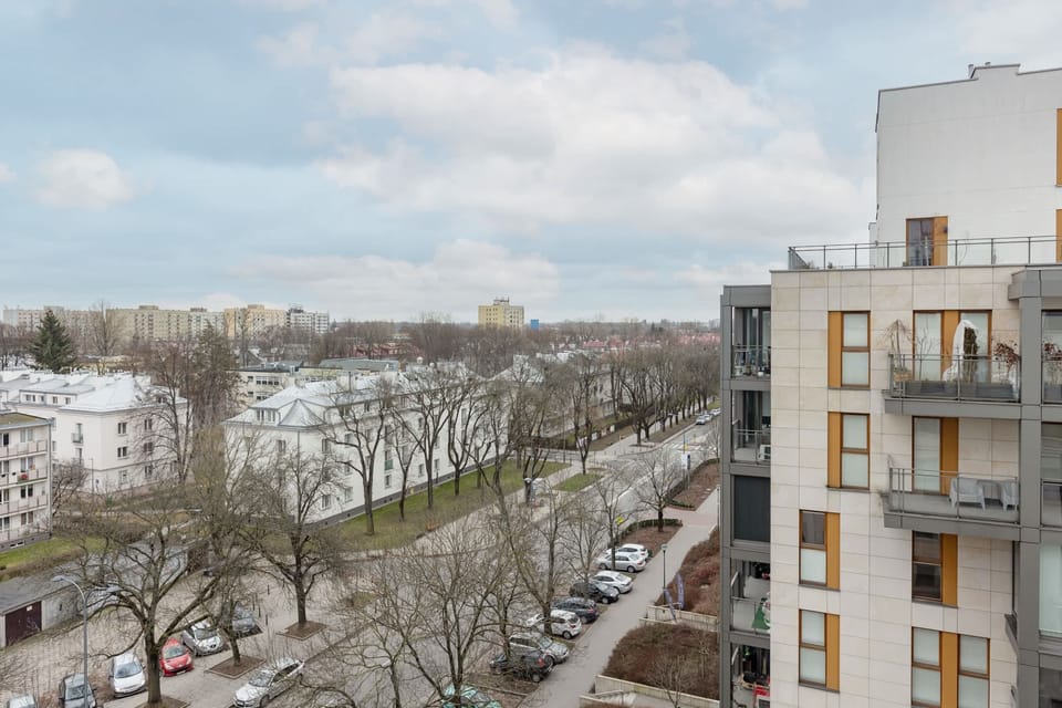 A scenic outdoor view showcasing residential buildings and greenery.
