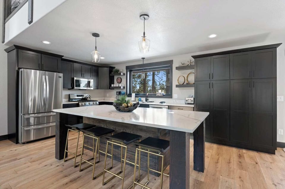 Kitchen island with bar seating, plenty of room to prep and gather. 