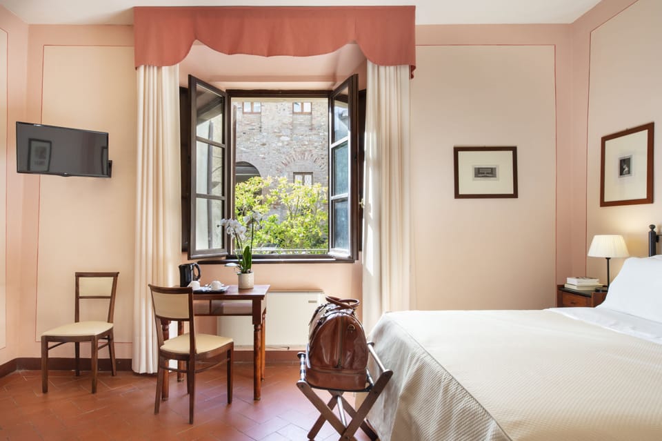 Double Room | Minibar, in-room safe, desk, iron/ironing board