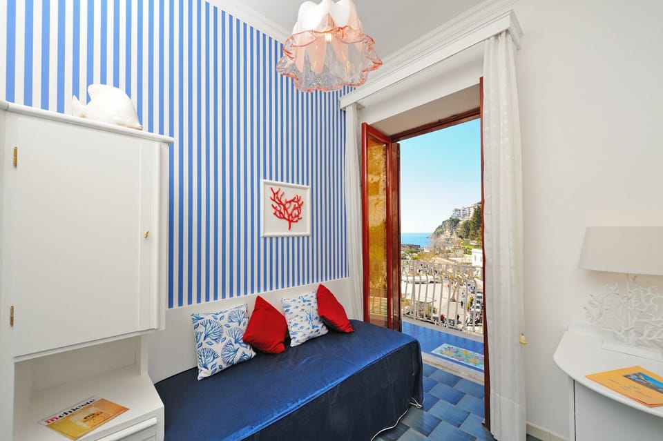 Double or Twin Room, Partial Sea View | Hypo-allergenic bedding, minibar, in-room safe, individually decorated