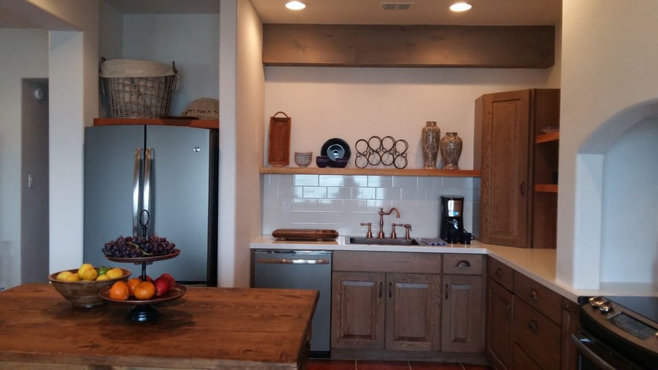 The newest Slate GE appliances   Spanish cedar shelving, copper faucet and sink RO puritfied water and ice.