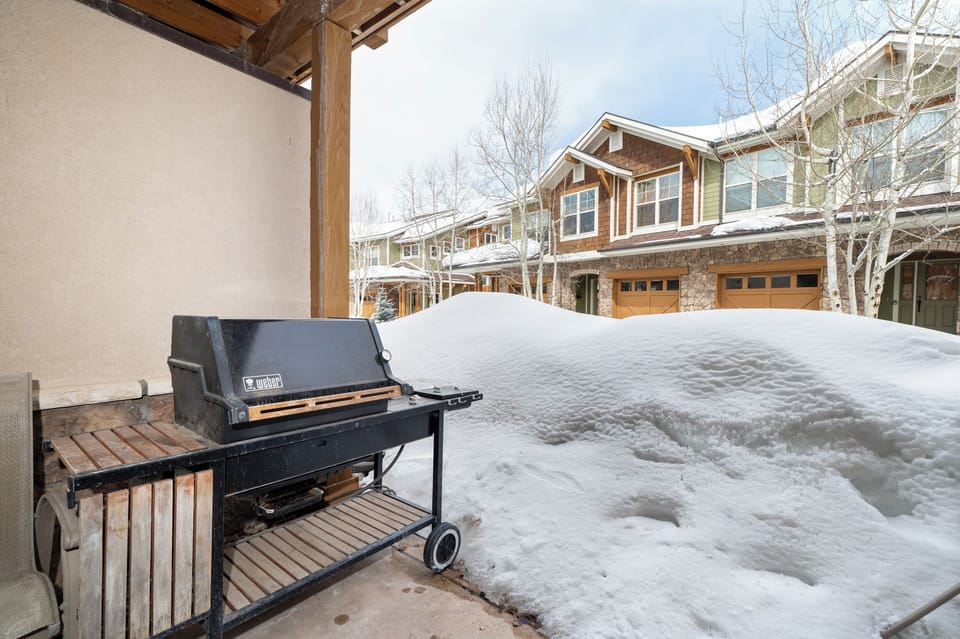 Fire up your private grill even in winter - your covered patio keeps BBQ dreams alive year-round with mountain charm.