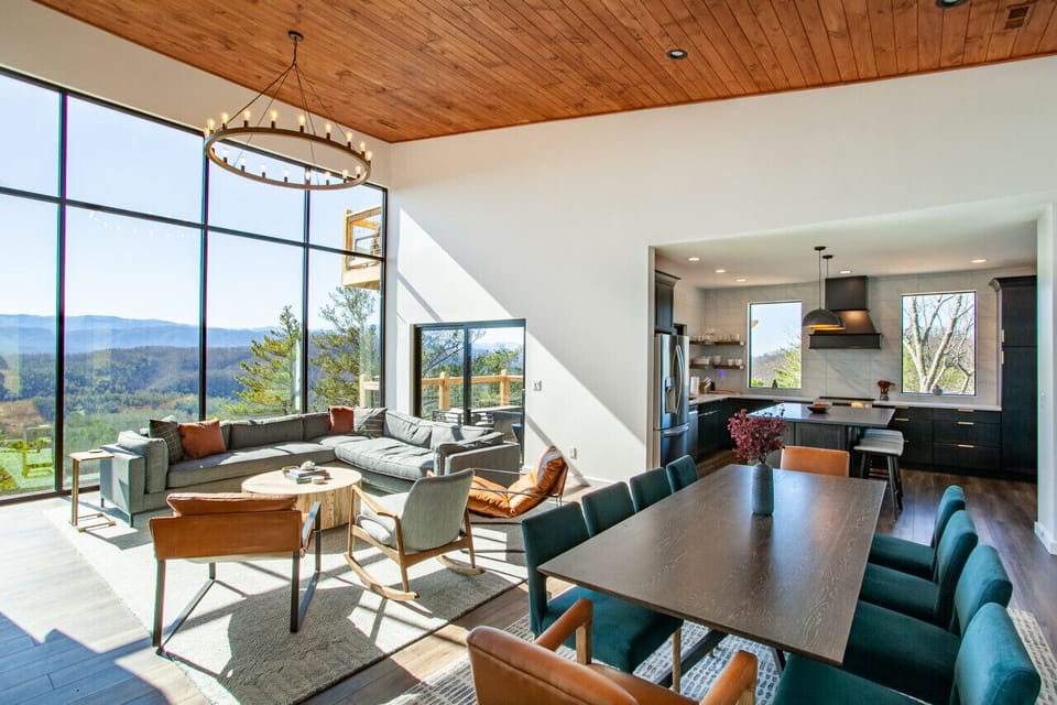 Gather around the dining area with a backdrop of stunning mountain scenery. This home was built to create unforgettable moments with family and friends.