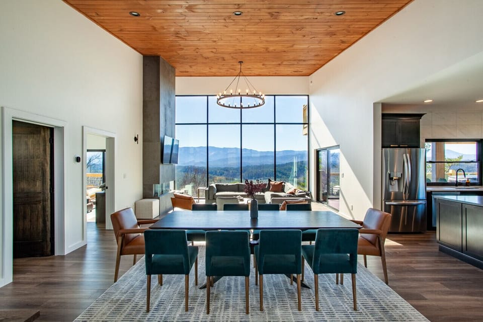 Host unforgettable dinners with stunning mountain views as your backdrop. The spacious dining area flows seamlessly into the open-concept living space.