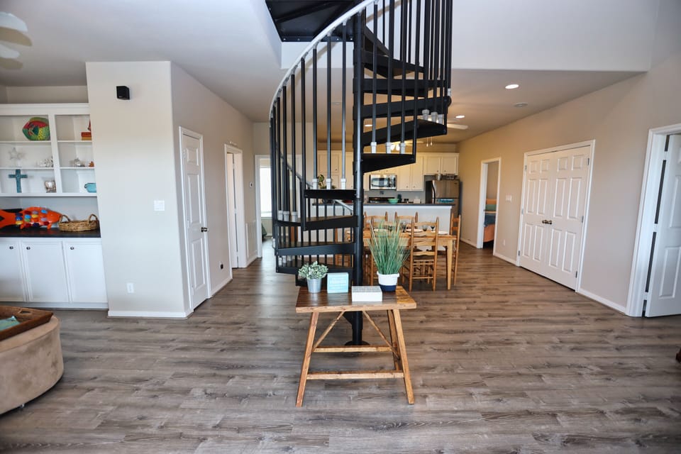 Stairs leading up to loft space 