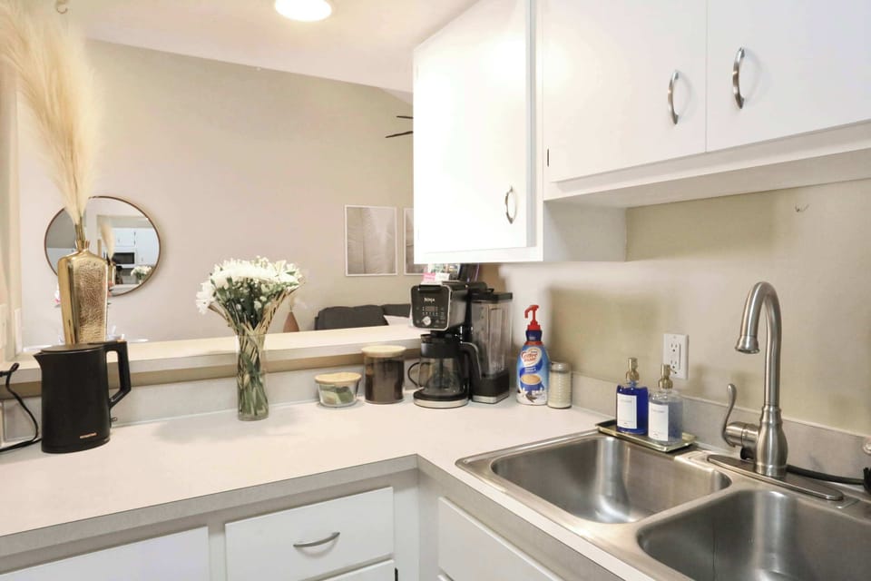 Modern, clean kitchen with all the essentials—including a double sink and countertop space to prep with ease.