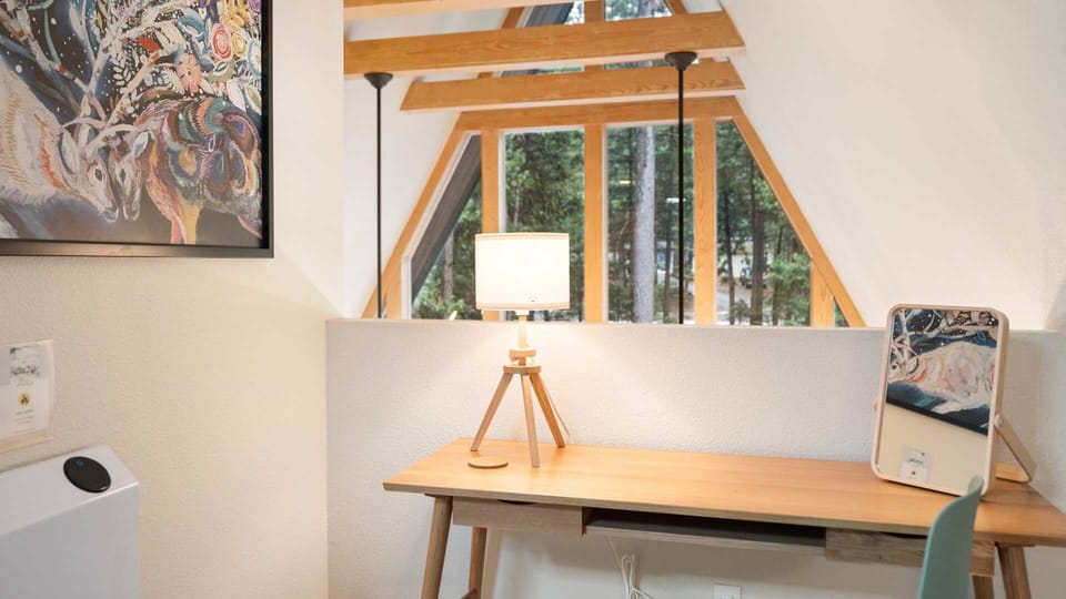This workspace in the loft has a desk and lamp. It’s right by the heater so you’ll definitely stay nice and warm while you sit. It also has excellent views!