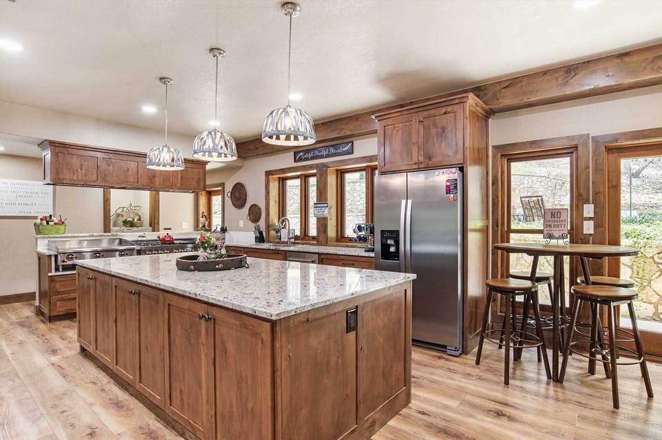 In tandem with the modern appliances, the kitchen is also well-stocked with cooking and serving ware, utensils, and glasses.