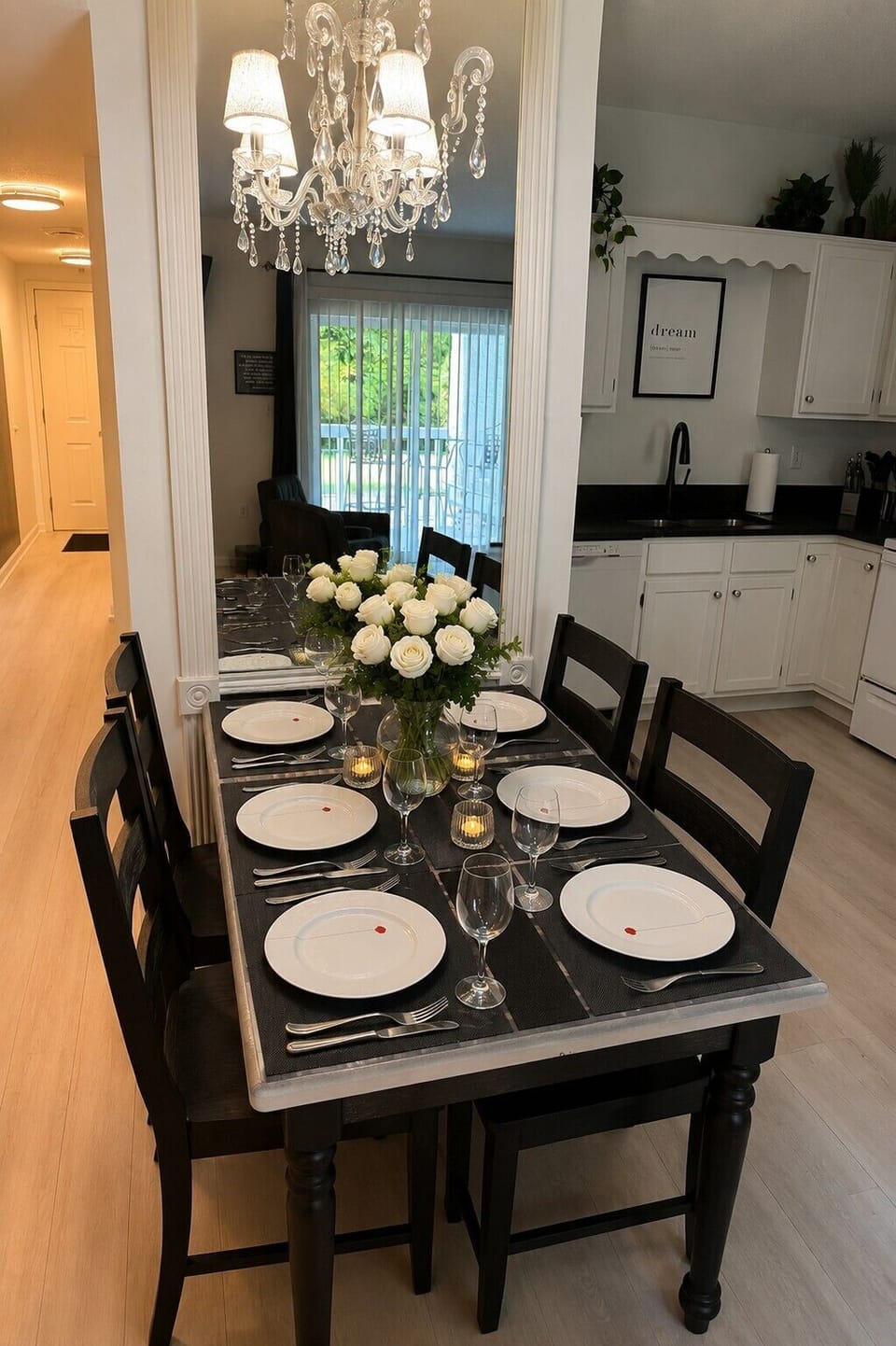 Set beneath a sparkling chandelier, this elegant dining space is perfect for everything from morning coffee to family dinners. With seating for four & thoughtful touches throughout, it's a welcoming place to relax, reconnect, and enjoy time together
