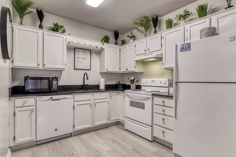 This kitchen comes complete with pots, pans, spices, oils and everything you need to create a meal at home.