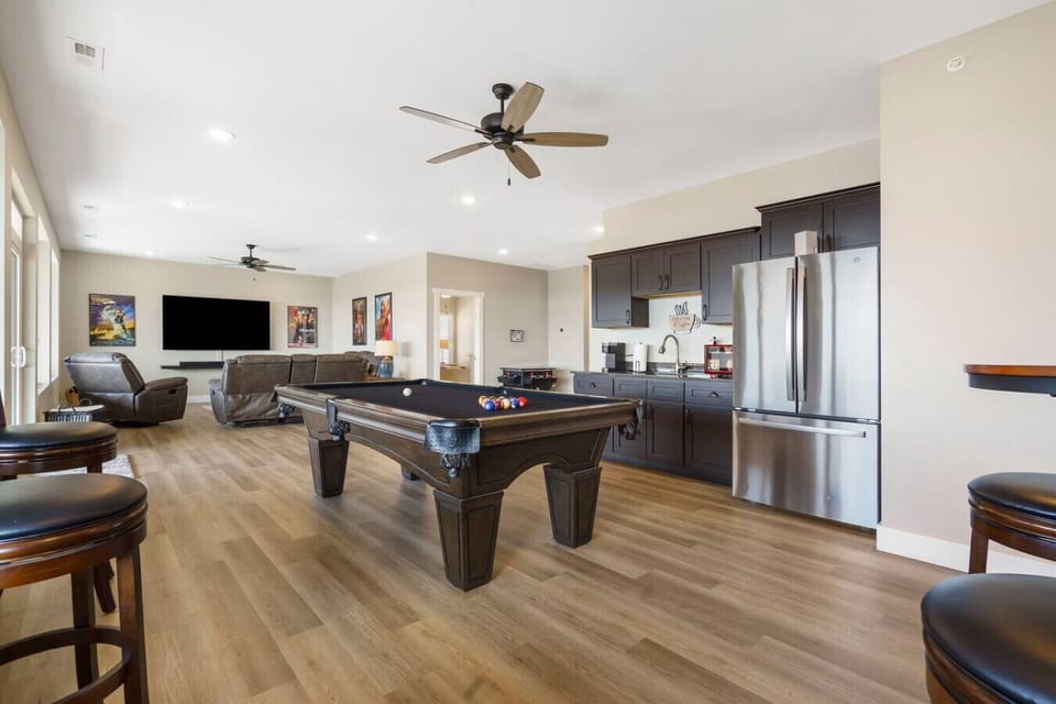 85 inch TV with surround sound bar to watch your favorite movie or sporting event.