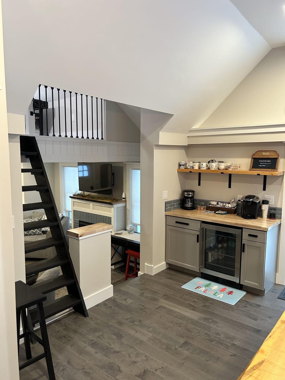Coffee bar in kitchen leading into sunken family room